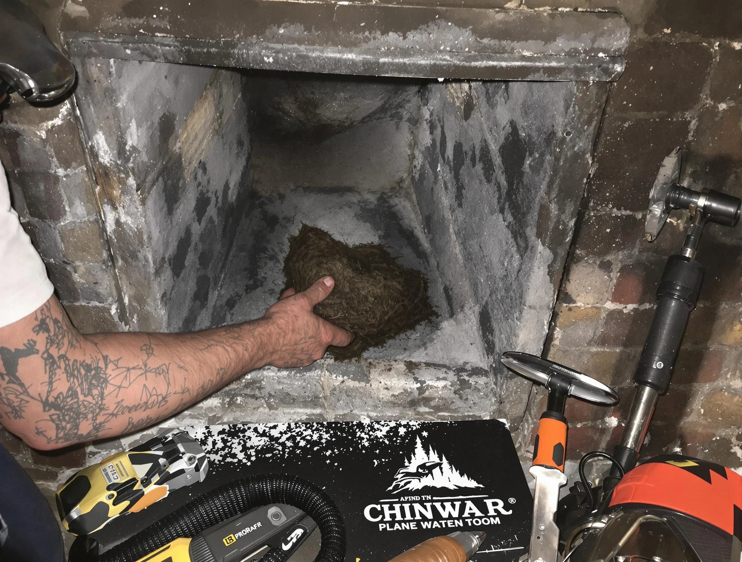 Clanton Chimney Sweep safely removing debris and screening chimney in Clanton, AL